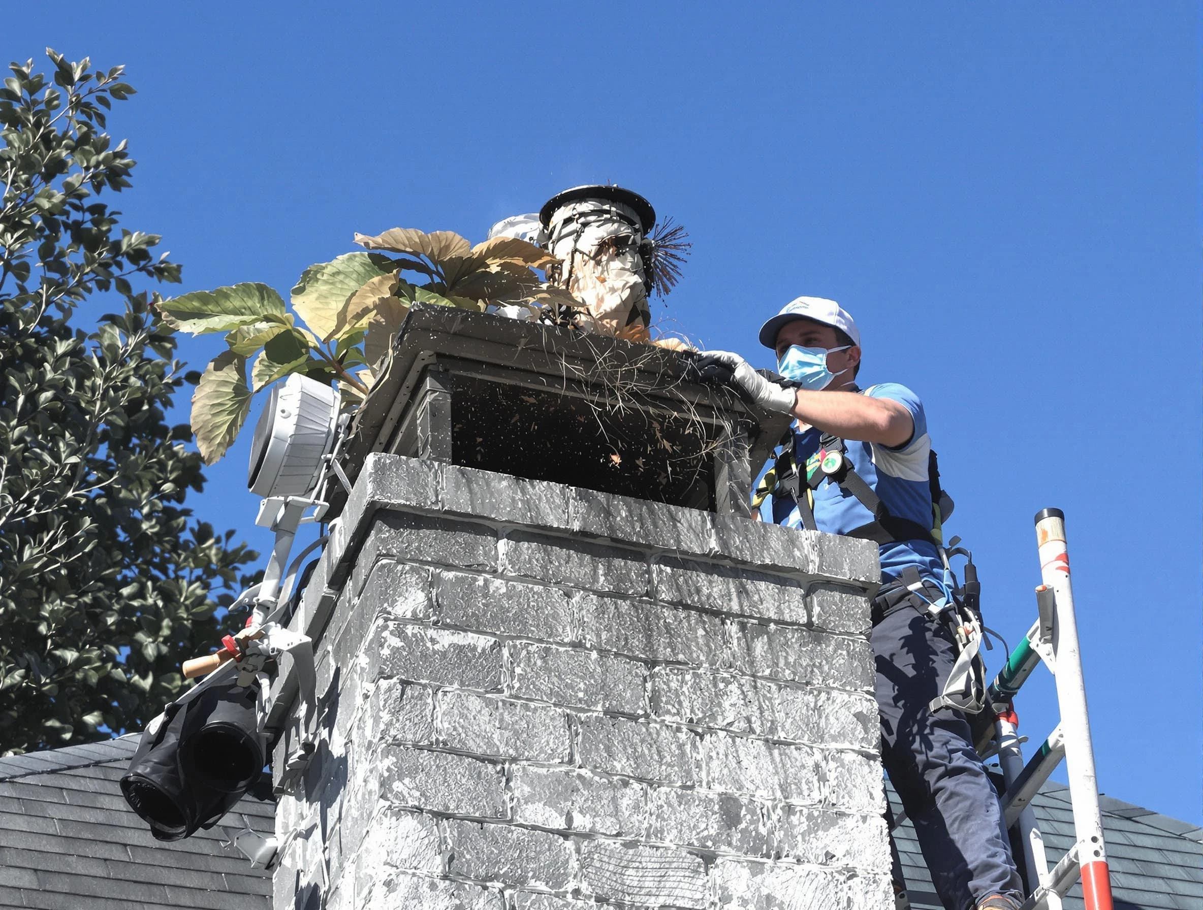 Glendale Chimney Sweep specialist performing chimney cleaning in Glendale, AZ